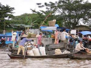 Floating Markets in Mekong: the Real and the Touristic